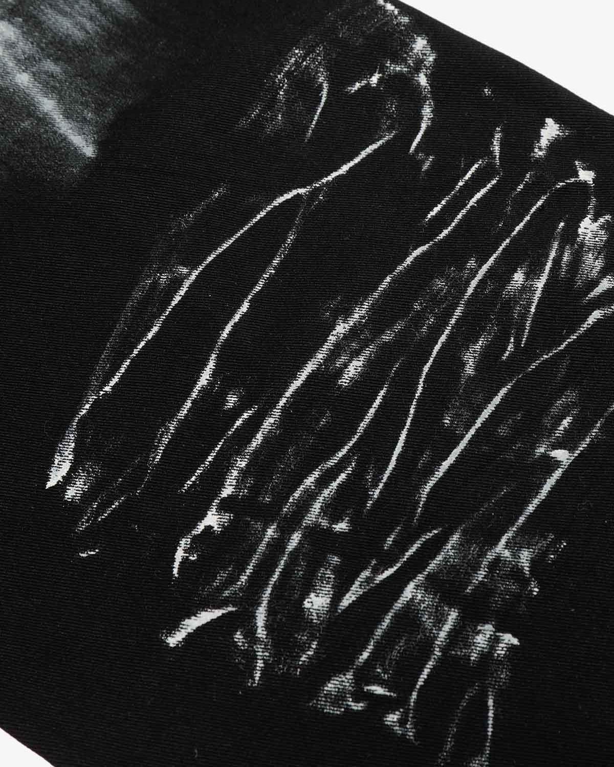 Black Star Paint Baggy Jeans featuring a wide-leg silhouette with off-white brush-stroke graphics, offering a bold, artistic streetwear aesthetic.