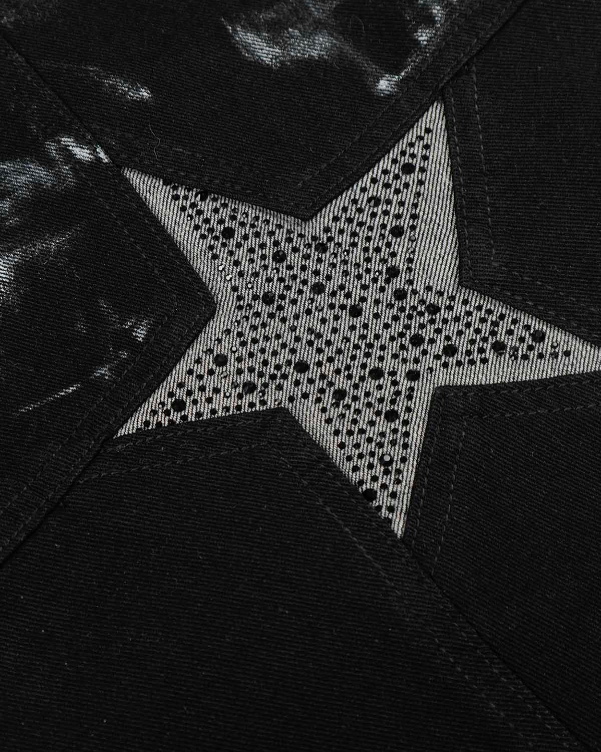 Black Star Paint Baggy Jeans feature a star-shaped inset with dot embellishments on black fabric, showcasing bold, artistic street-style aesthetics and oversized design.