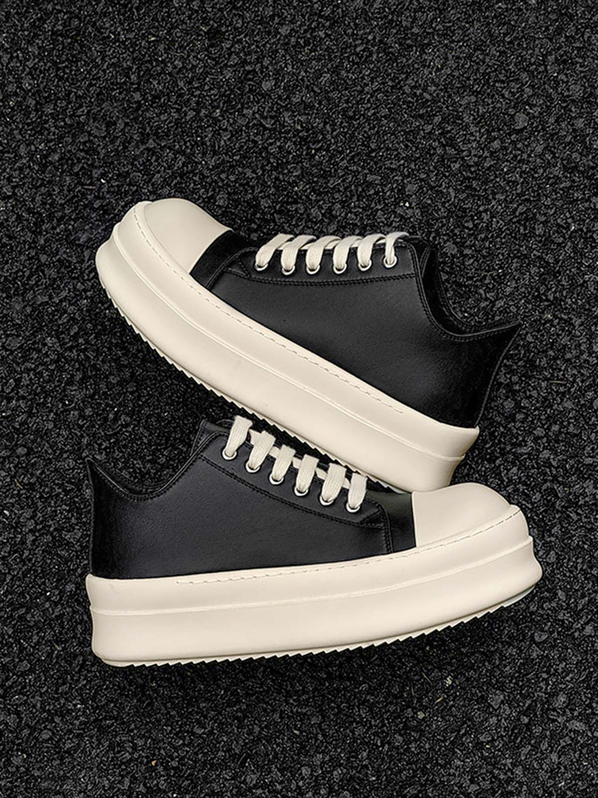 Chunky Low-Top Streetwear Sneakers with black leather uppers, off-white platform soles, and matching laces, offering a bold contrast and modern streetwear style.
