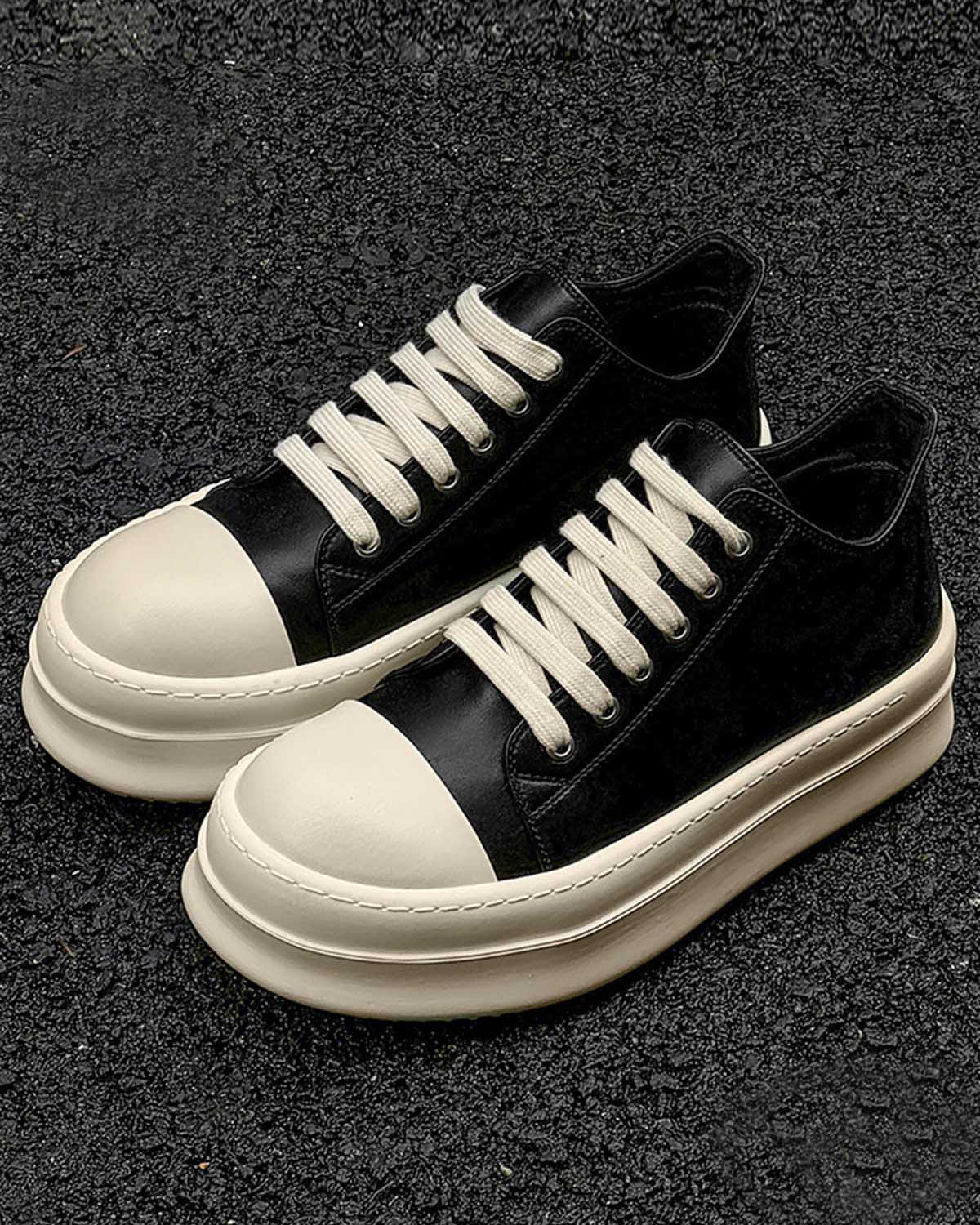 Chunky Low-Top Streetwear Sneakers with smooth black upper, off-white rubberized toe cap, and thick platform sole, offering bold style and modern streetwear appeal.