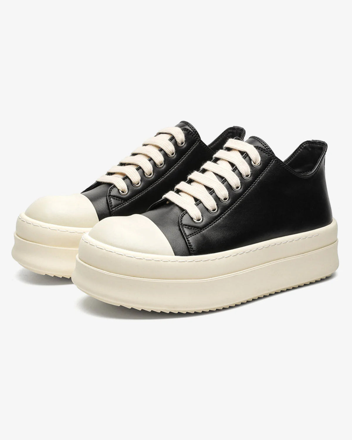 Chunky Low-Top Streetwear Sneakers with black uppers, off-white toe caps and thick soles, offering a bold, German-trainer inspired silhouette for modern streetwear.