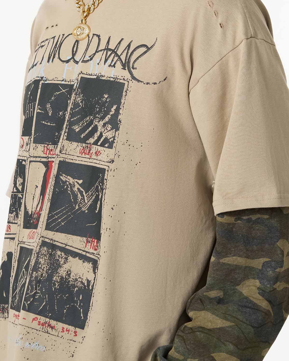 Distressed Grunge Layered T-Shirt featuring vintage graphics, camo-patterned long sleeves, and a gold-tone chain with a circular pendant for a bold streetwear look.