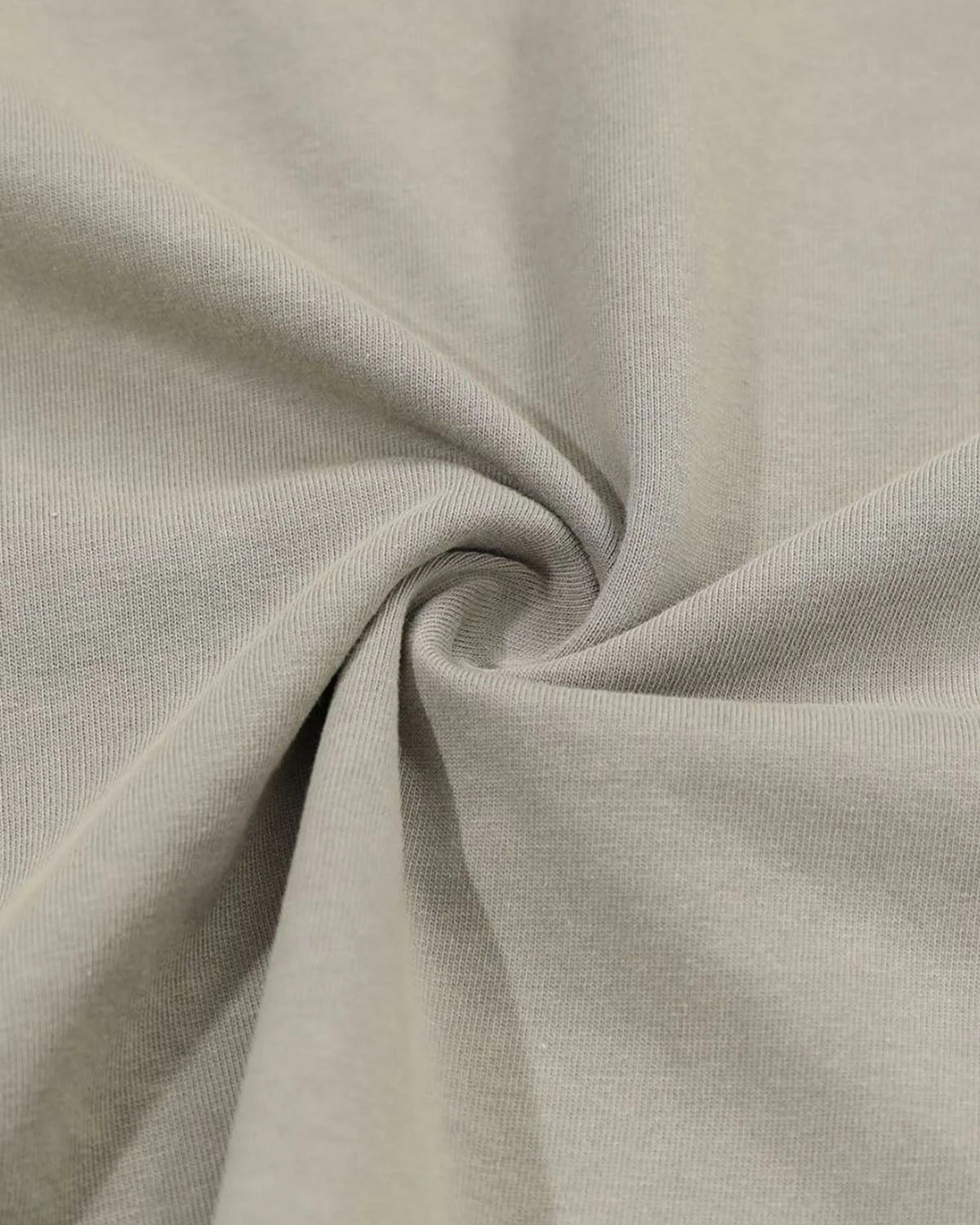 Distressed Grunge Layered T-Shirt featuring a close-up of beige knit fabric texture, showcasing its gathered texture, highlighting the layered camo sleeves and vintage graphic style.