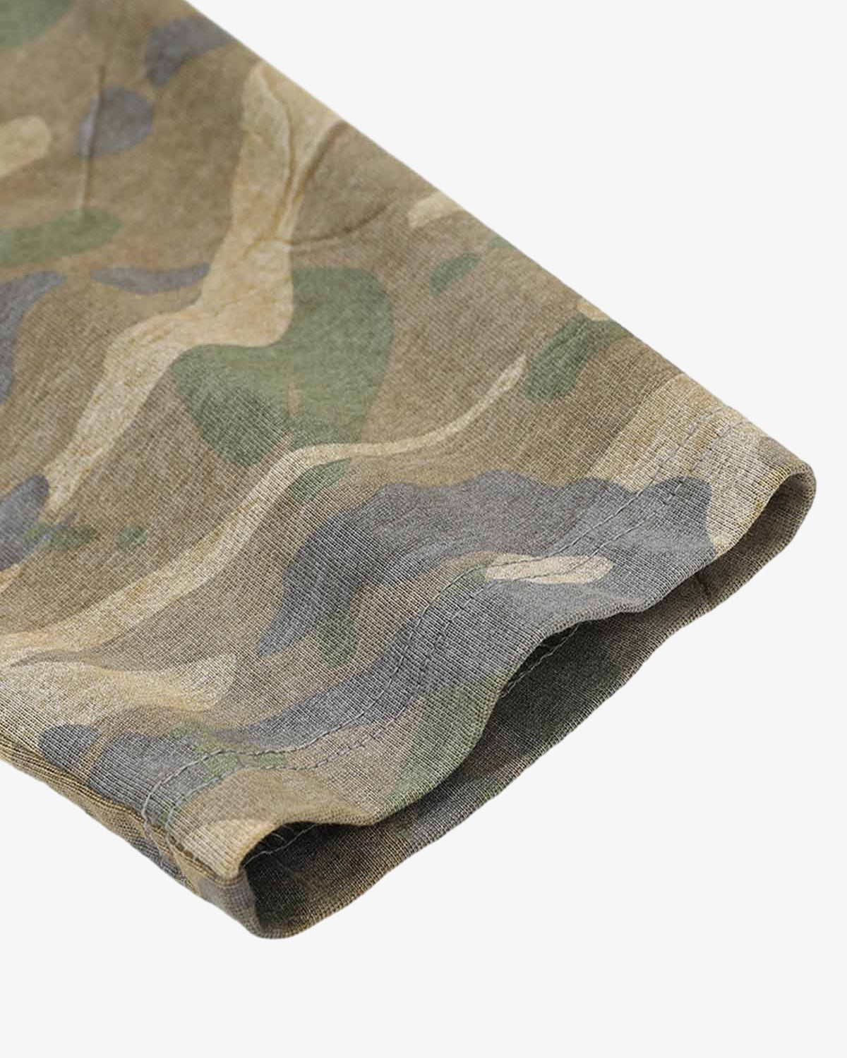 Close-up of Distressed Grunge Layered T-Shirt showcasing a camo-patterned long sleeve hem, highlighting its layered design and raw street style appeal.