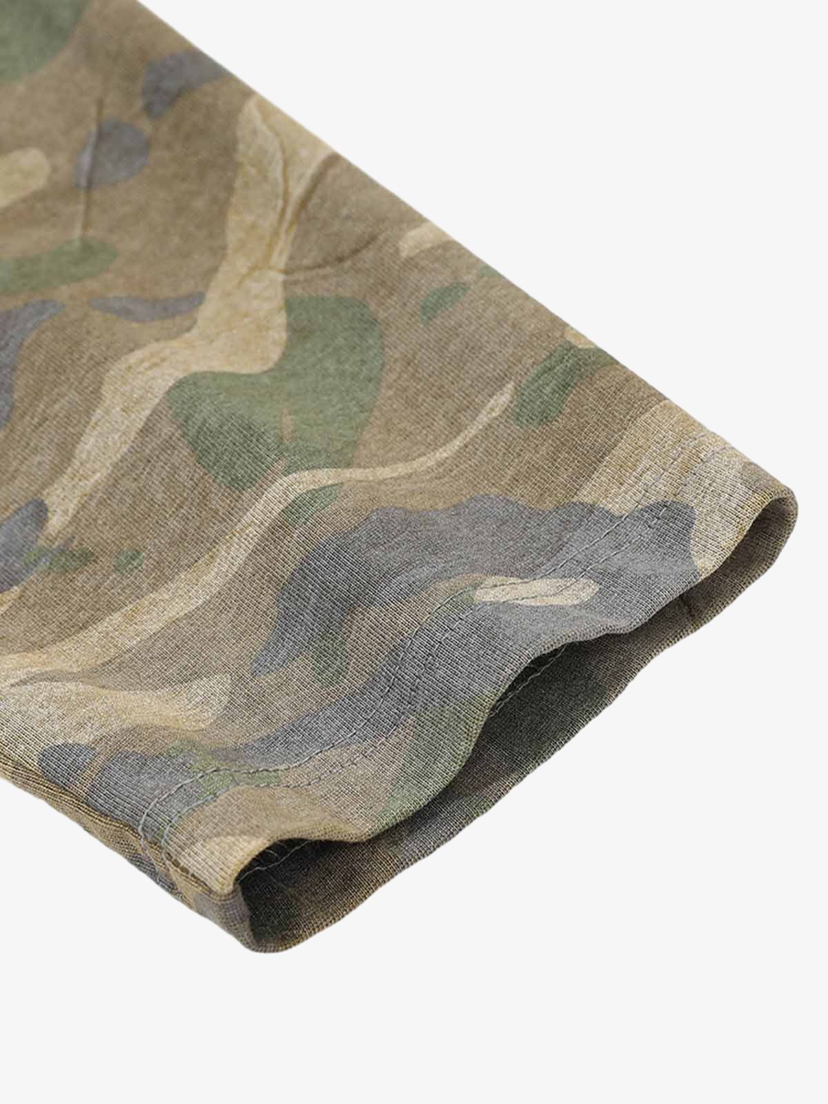 Close-up of Distressed Grunge Layered T-Shirt showcasing a camo-patterned long sleeve hem, highlighting its layered design and raw street style appeal.