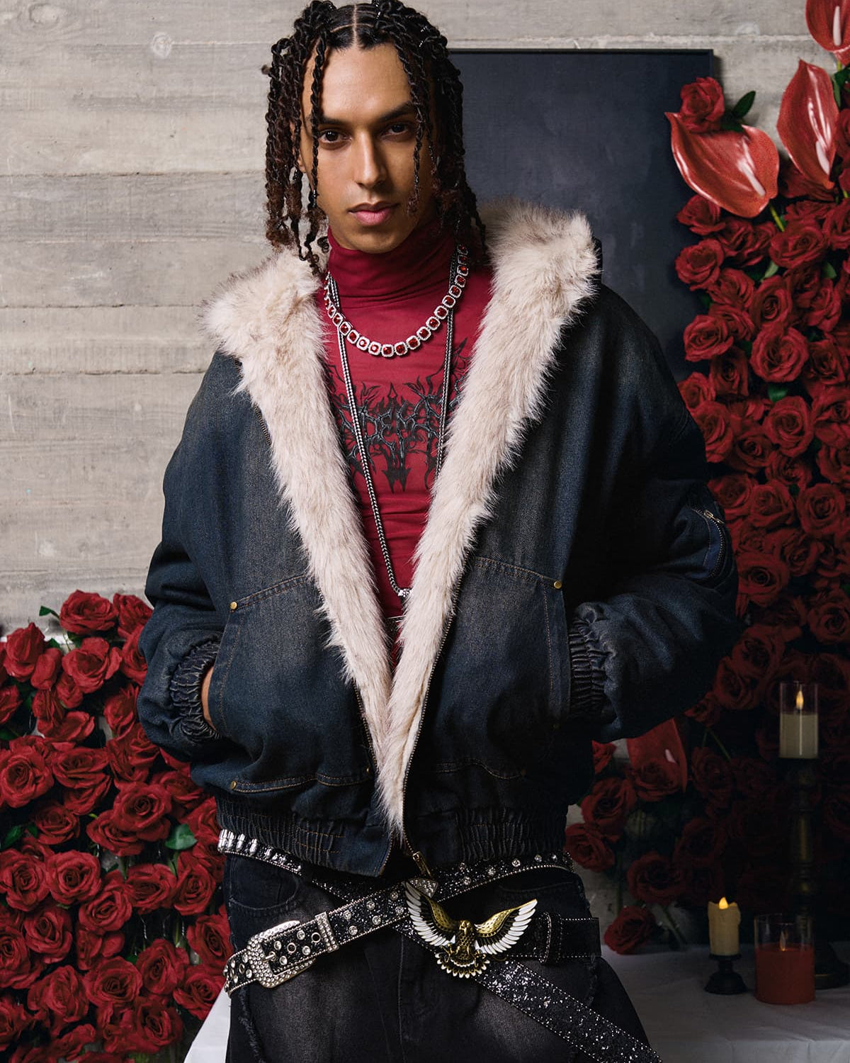 Young person in a Distressed Washed Faux Fur Winter Jacket with a dark denim finish, showcasing a moody, urban style with layered silver necklaces.