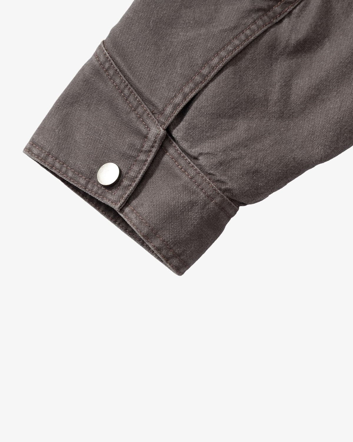 Close-up of Graphic Graffiti High Neck Street Jacket's grey canvas-style cuff with topstitching and silver snap button, highlighting its streetwear detail.