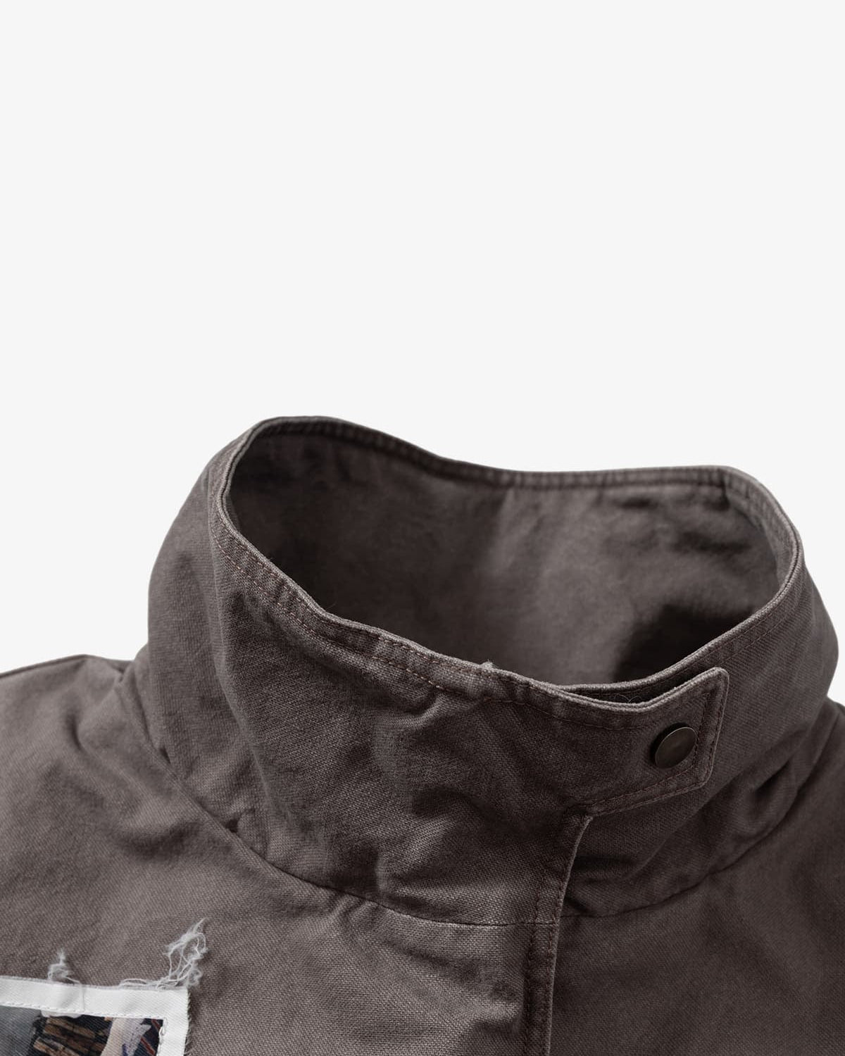 Close-up of the Graphic Graffiti High Neck Street Jacket, highlighting the textured charcoal fabric, stand-up collar, and snap-button tab, embodying bold streetwear style.