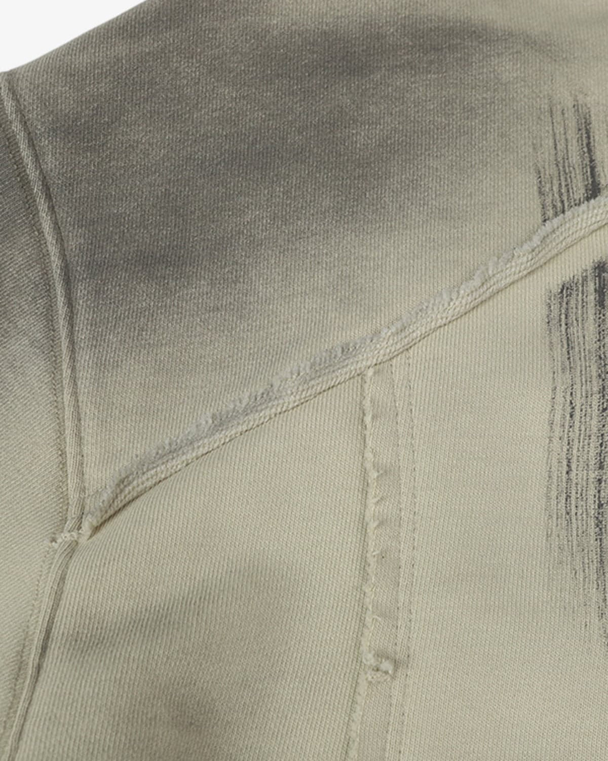 Ink Dyed Raw-Edge Streetwear Hoodie close-up showing diagonal and vertical seams, distressed areas, and ink-dyed fading for a rugged, oversized streetwear aesthetic.