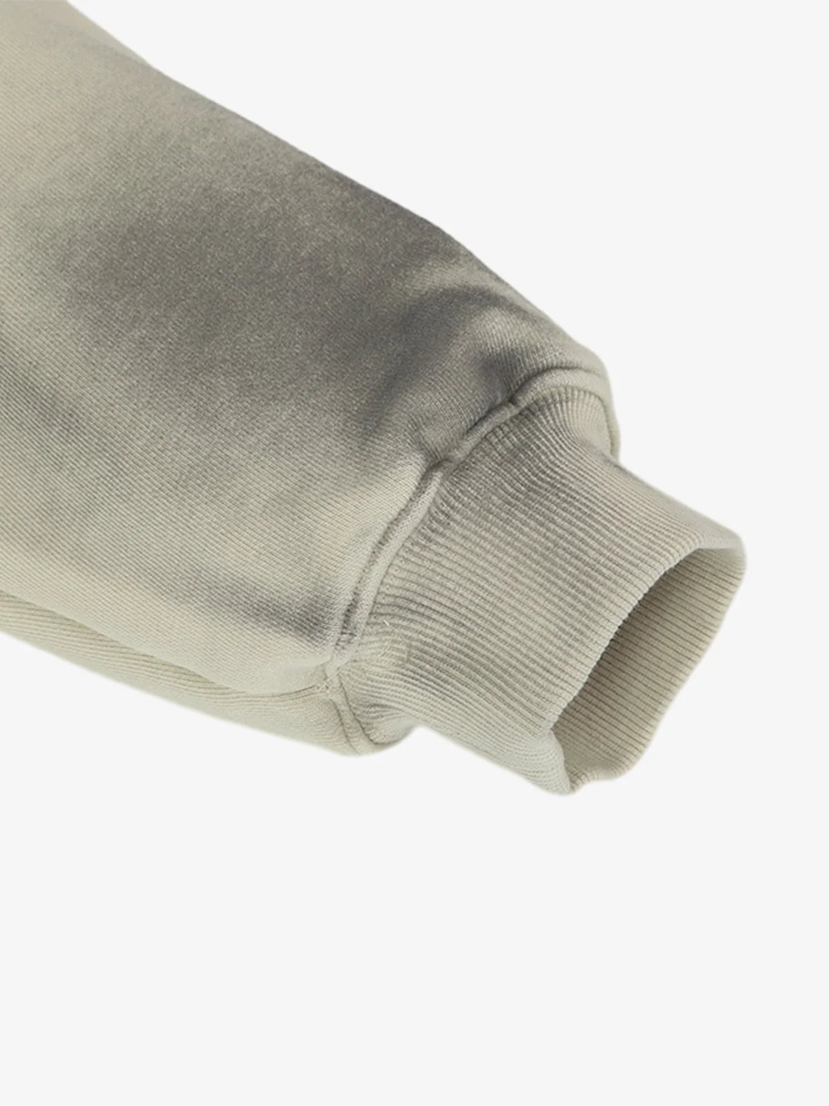 Close-up of the Ink Dyed Raw-Edge Streetwear Hoodie's sleeve, showcasing the ribbed cuff and ink-dyed fading for a bold, oversized streetwear aesthetic.