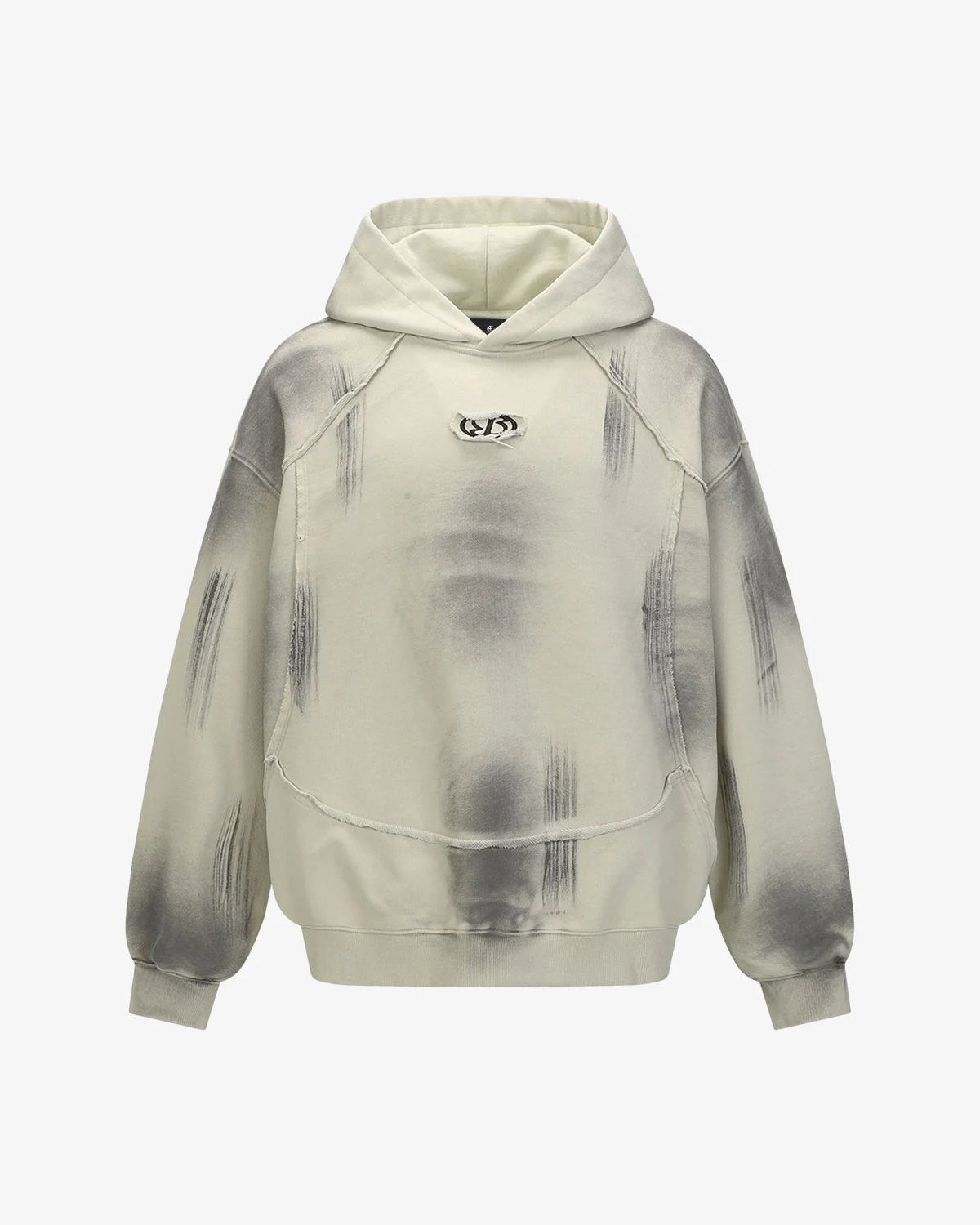 Ink Dyed Raw-Edge Streetwear Hoodie with spray-stenciled effect, exposed seams, and oversized fit, featuring a kangaroo pocket and small chest logo for bold street style.