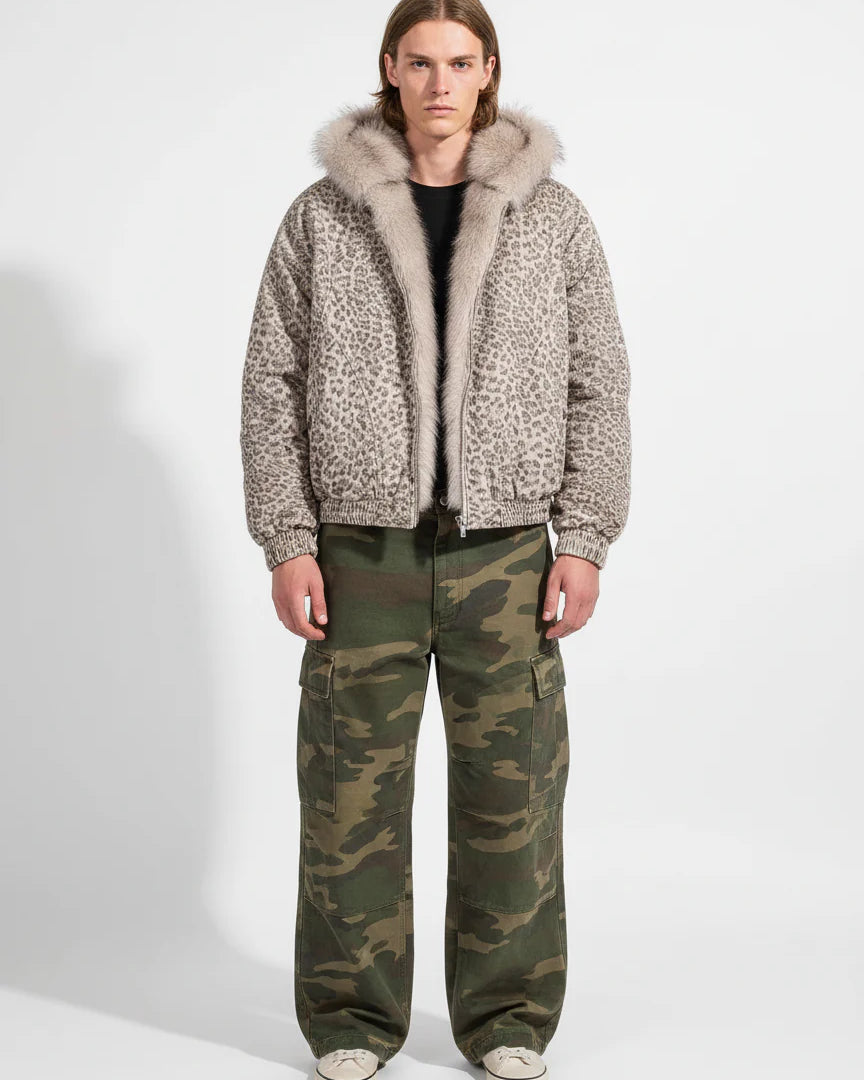 Young man wearing Leopard Faux Fur Hooded Jacket, showcasing its bold leopard print and fluffy hood, paired with camouflage cargo pants and sneakers.
