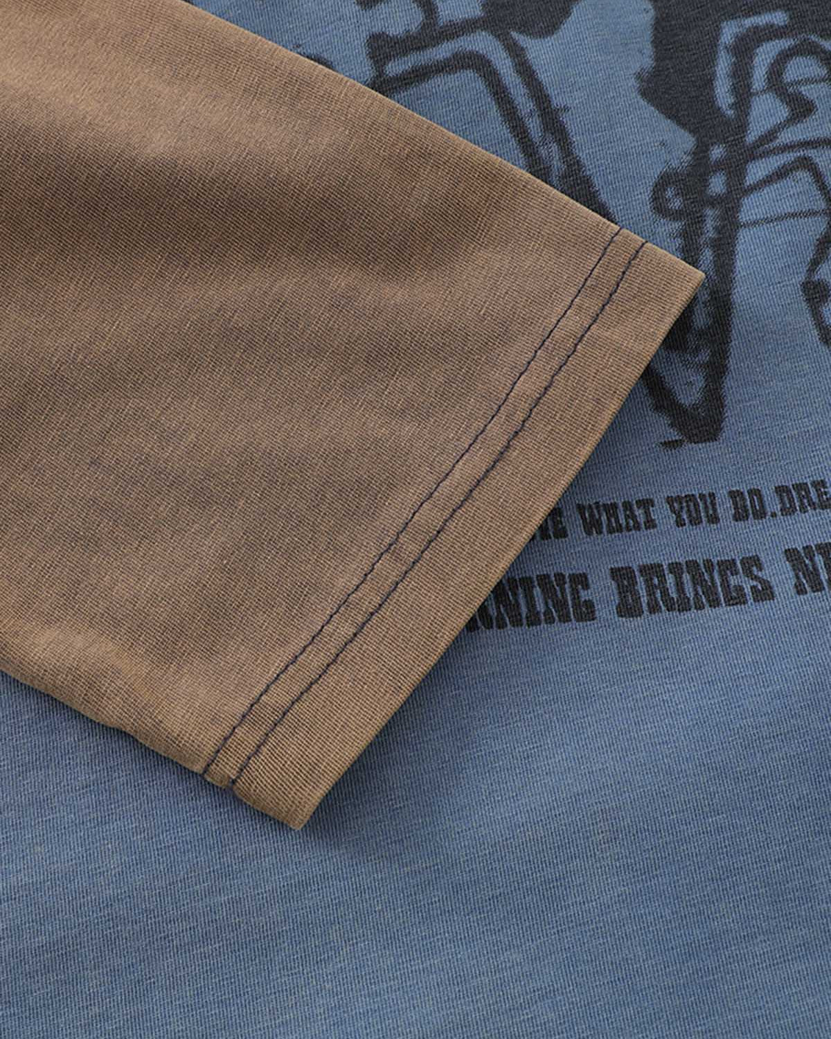Retro Graphic Layered Streetwear T-Shirt featuring a brown sleeve over a blue shirt with drone graphics and stencil-style text, showcasing a vintage street aesthetic.