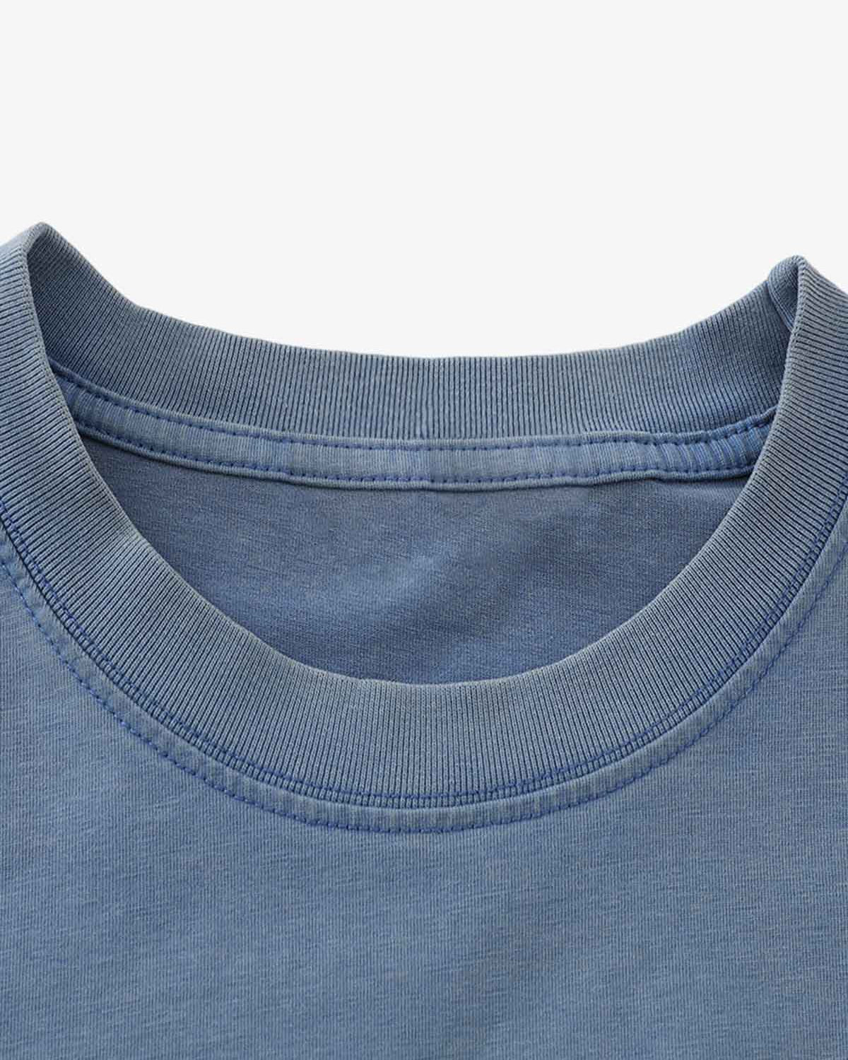 Close-up of Retro Graphic Layered Streetwear T-Shirt's ribbed neckline, showcasing stitching details, highlighting the layered design and vintage streetwear aesthetic.