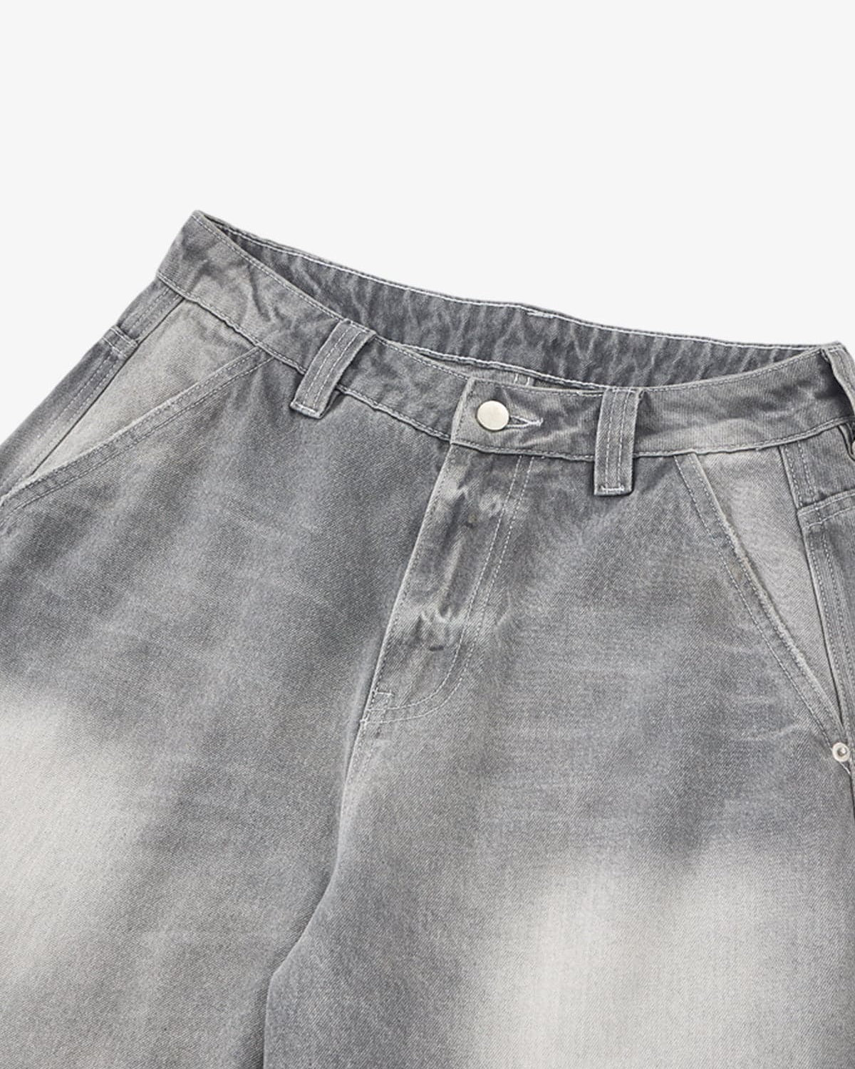 Retro Washed Grey Baggy Jeans; upper view showing faded wash, waistband with belt loops, metal button, and angled front pockets, highlighting vintage streetwear style.