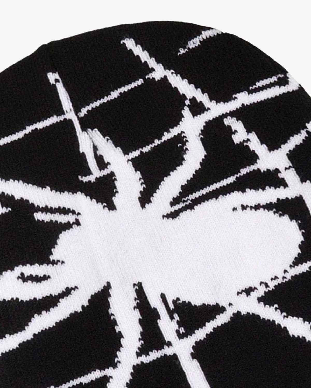 Spider Web Graphic Knit Hat featuring a bold white spider silhouette and web design on a black knit fabric, ideal for Y2K and grunge streetwear styles.