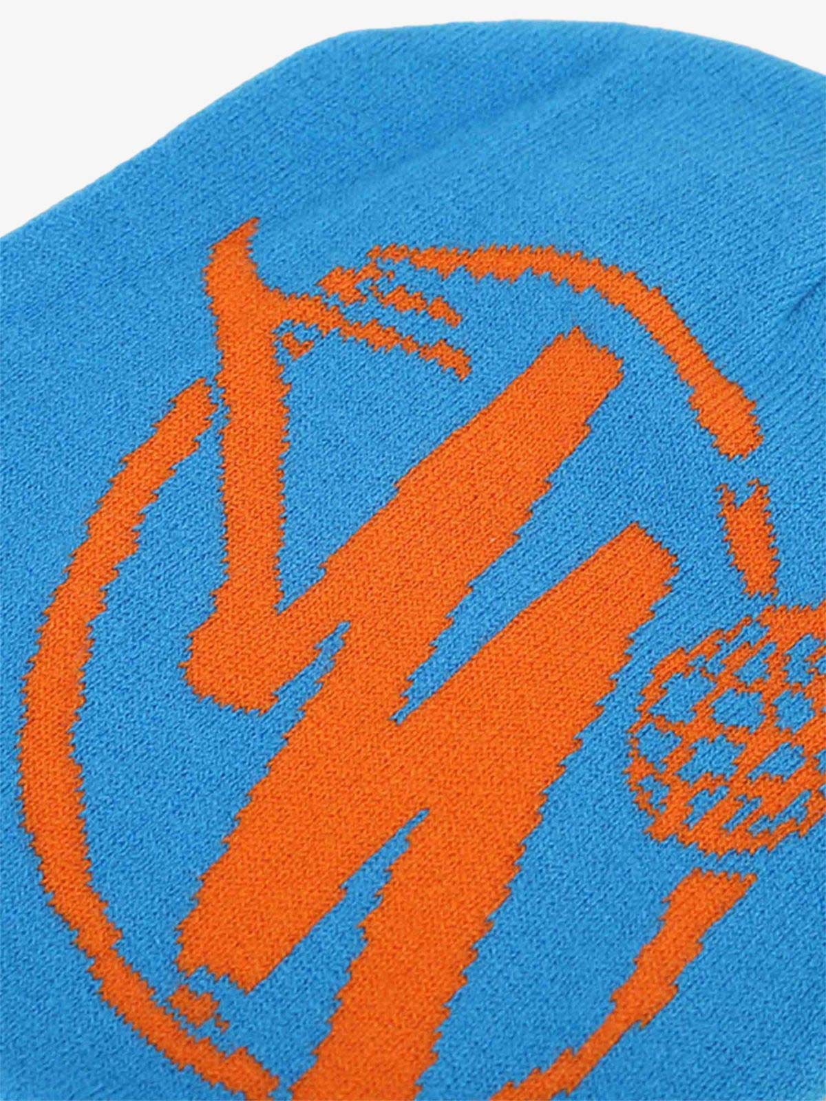 Streetwear Knit Hat featuring a bold orange stylized M graphic on bright blue knit, perfect for adding a bold touch to urban fashion.