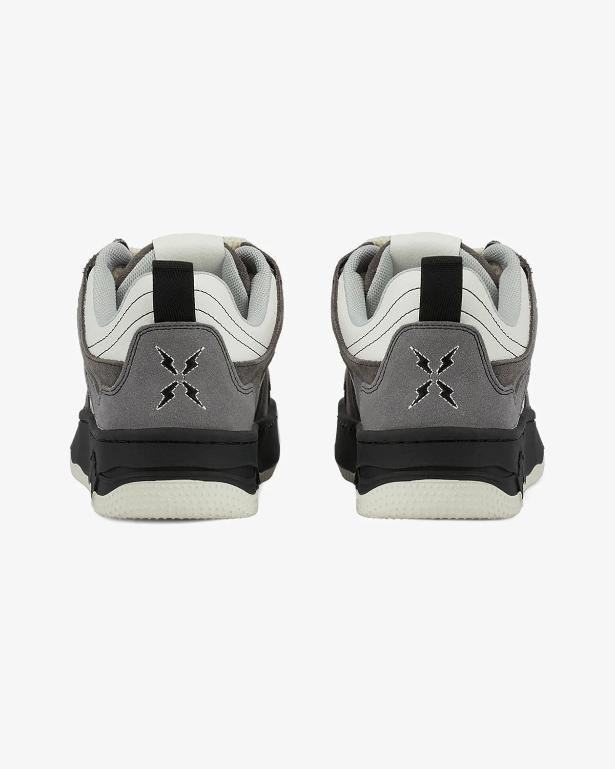 Back view of Vintage Chunky Graphic Skate Shoes, featuring grey suede heel panels, black midsoles, and white leather uppers, showcasing stitched logos and black heel pull-tabs.