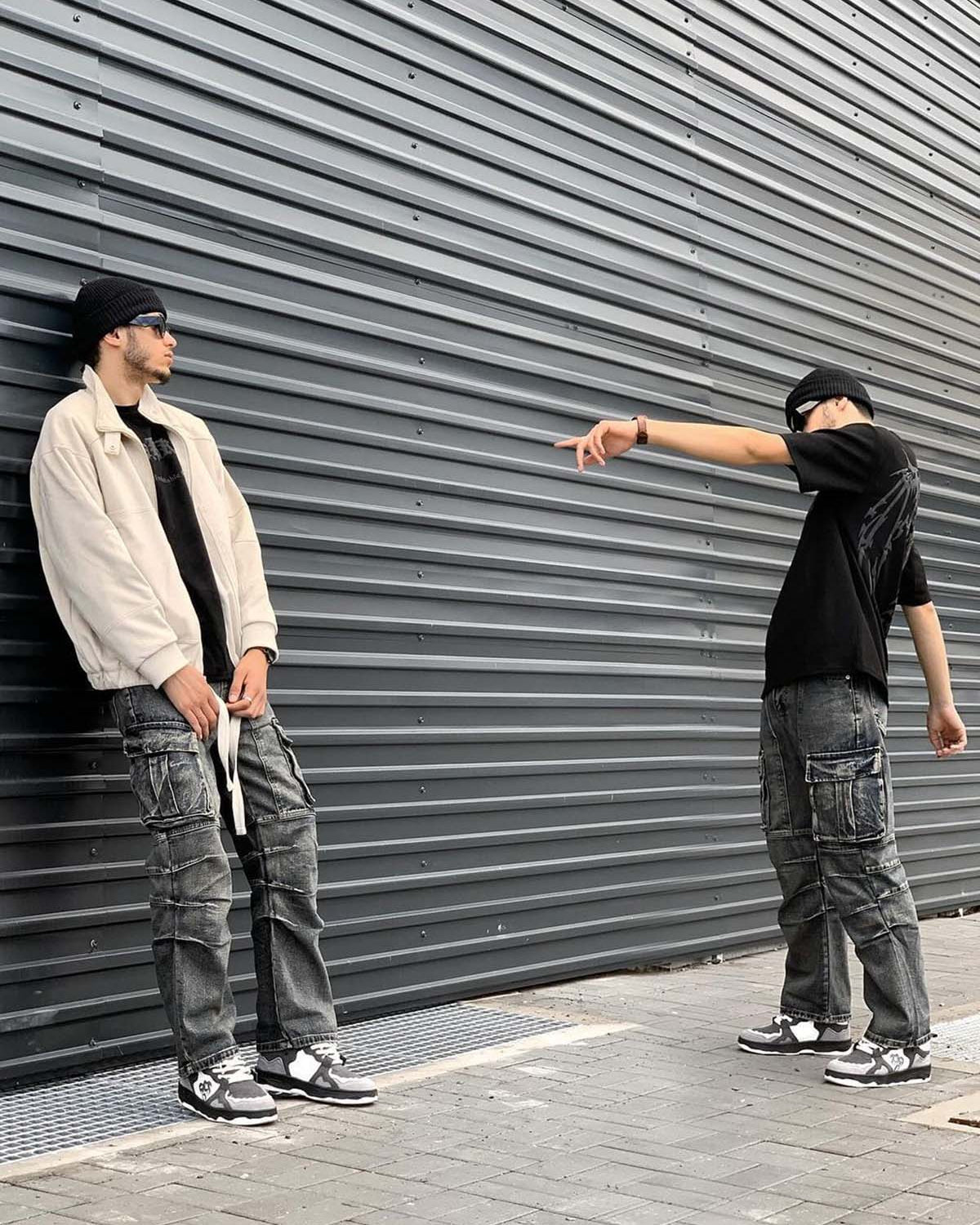 Young man in street style wearing Vintage Chunky Graphic Skate Shoes, showcasing their bold, low-top silhouette and graphic detailing in a modern urban setting.