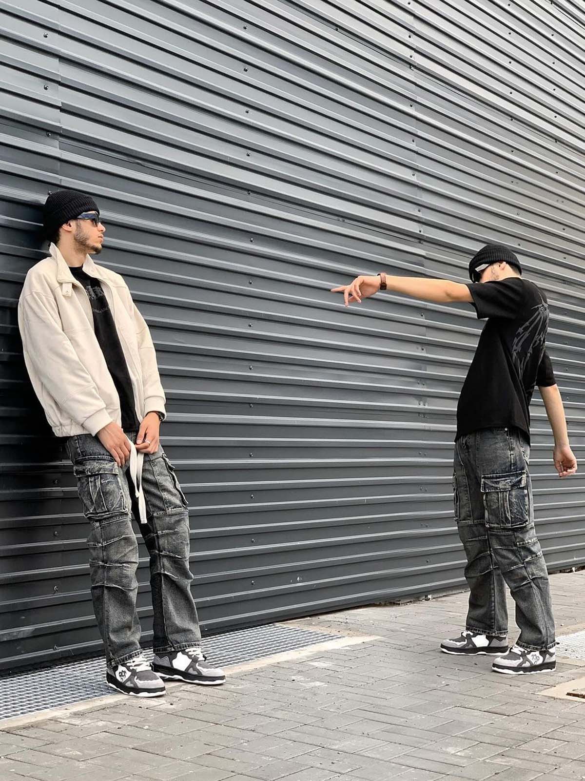 Young man in street style wearing Vintage Chunky Graphic Skate Shoes, showcasing their bold, low-top silhouette and graphic detailing in a modern urban setting.