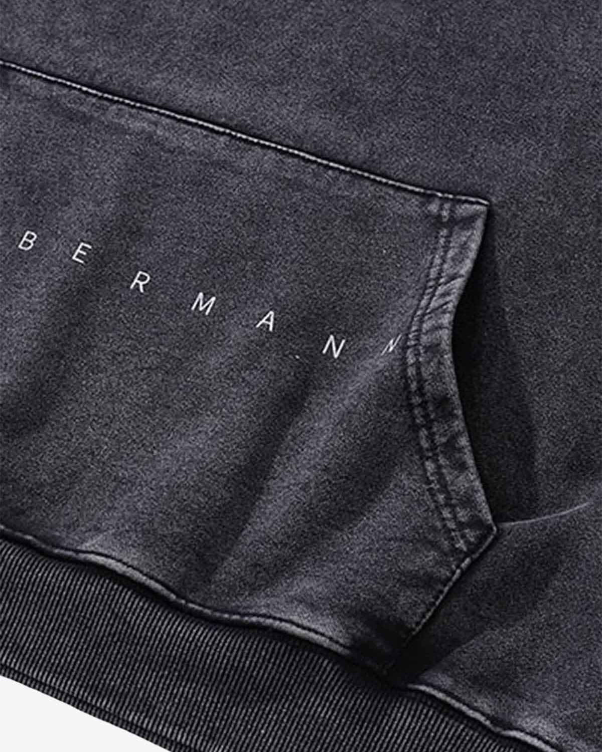 Close-up of the Vintage Doberman Graphic Streetwear Hoodie, showcasing the BERMANN lettering above the kangaroo pocket seam, highlighting its bold streetwear design.