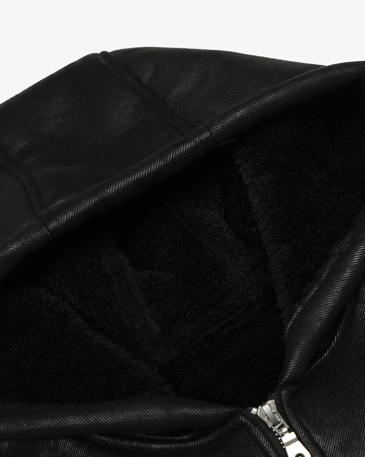 Close-up of the Vintage Hooded Leather-Look Street Jacket, showcasing its plush fleece-lined hood and part of the metal zipper at the hem.