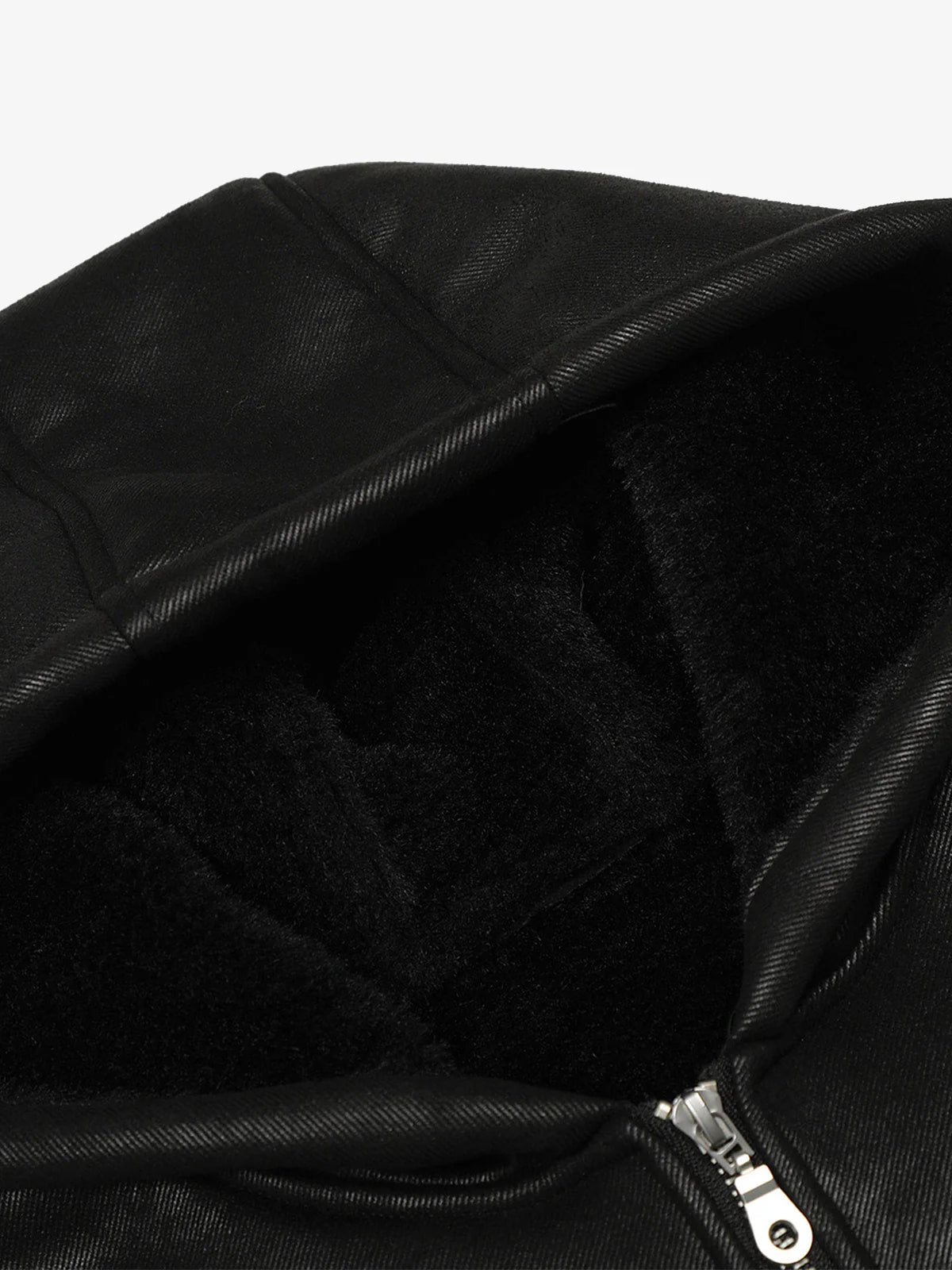 Close-up of the Vintage Hooded Leather-Look Street Jacket, showcasing its plush fleece-lined hood and part of the metal zipper at the hem.