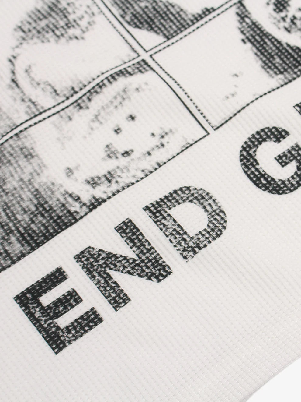 Vintage Waffle Graphic Long-Sleeve T-Shirt with a black-ink print showing a grid with a smiley face and partial slogan END G for a retro street look.