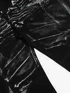 Black Star Paint Baggy Jeans featuring a wide-leg silhouette with abstract white streaks and star graphics, capturing a bold, artistic street-style aesthetic.