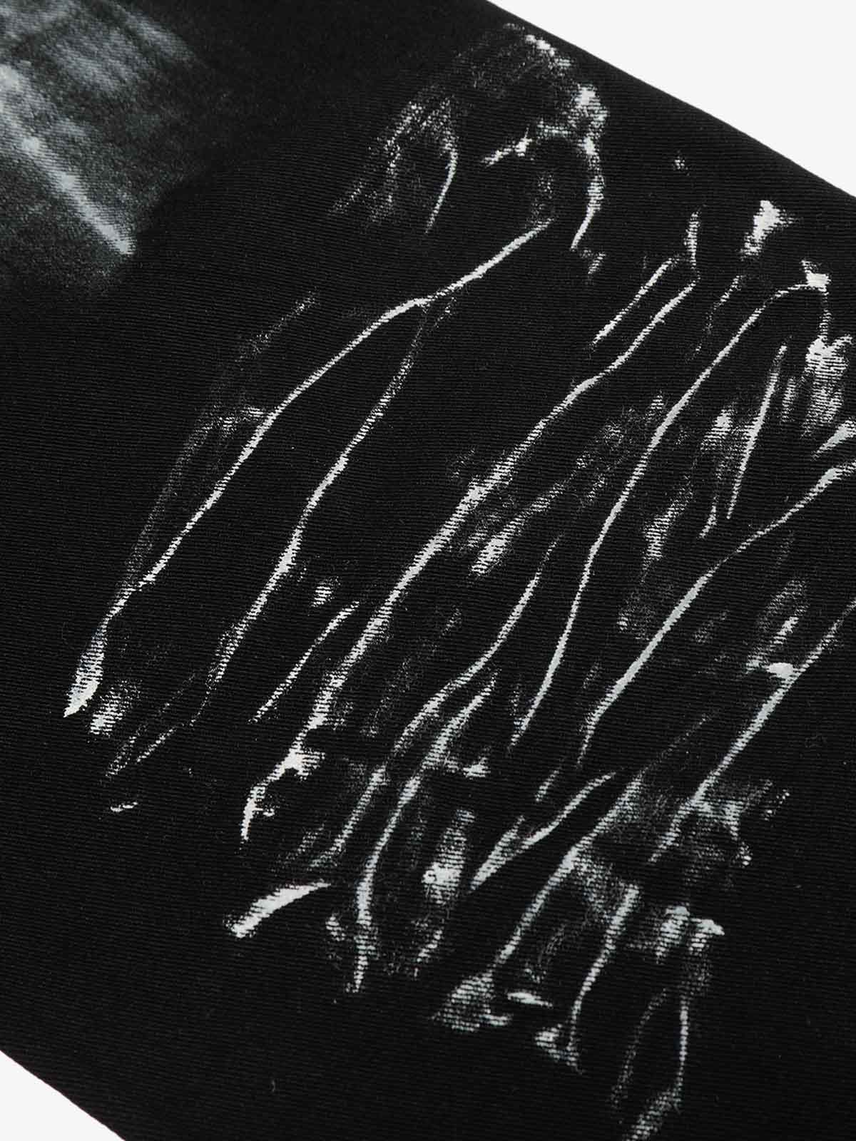 Black Star Paint Baggy Jeans featuring a wide-leg silhouette with off-white brush-stroke graphics, offering a bold, artistic streetwear aesthetic.