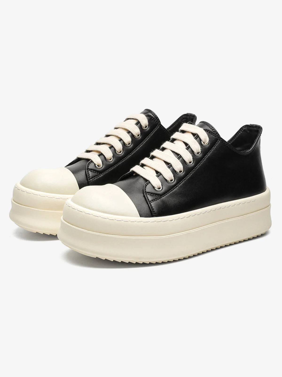 Chunky Low-Top Streetwear Sneakers with black uppers, off-white toe caps and thick soles, offering a bold, German-trainer inspired silhouette for modern streetwear.