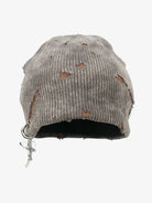 Distressed Charm Knit Hat: A gray, slouch-style beanie with deliberate distressing, featuring a cross charm on a silver ring, perfect for grunge and streetwear styles.