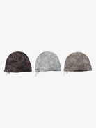 Three Distressed Charm Knit Hats with washed textures and metal charm details, showcasing dark, light gray, and dusty brown designs for grunge and streetwear styles.
