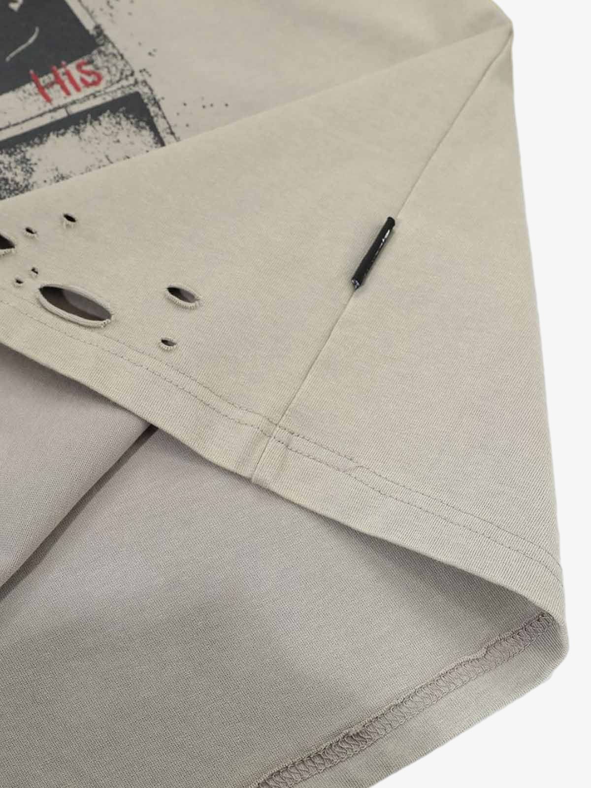 Distressed Grunge Layered T-Shirt with taupe cotton, red HIS graphic, black label, distressed holes, and camo long sleeves for a vintage, layered streetwear look.