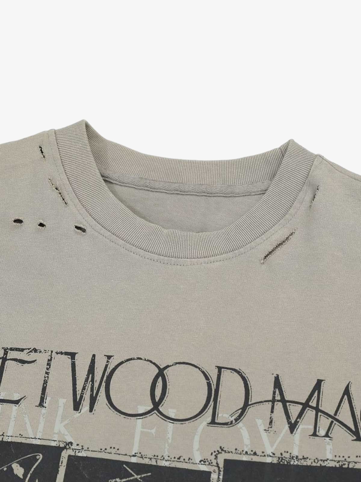 Distressed Grunge Layered T-Shirt with ribbed crew-neck, distressed holes, faded graphic, and built-in camo sleeves for a vintage, streetwear look.