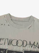 Distressed Grunge Layered T-Shirt with ribbed crew-neck, distressed holes, faded graphic, and built-in camo sleeves for a vintage, streetwear look.