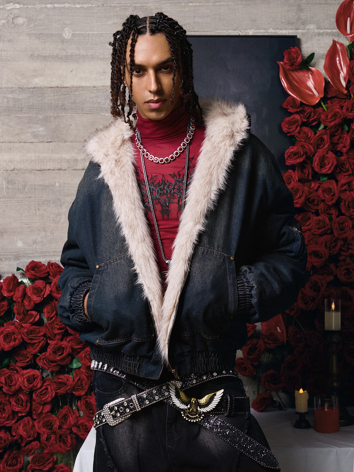 Young person in a Distressed Washed Faux Fur Winter Jacket with a dark denim finish, showcasing a moody, urban style with layered silver necklaces.