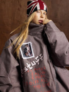 Young person wearing the Graphic Graffiti High Neck Street Jacket with bold streetwear graphics, high collar, and edgy, urban style, featuring RESTUFF and expressive phrases.