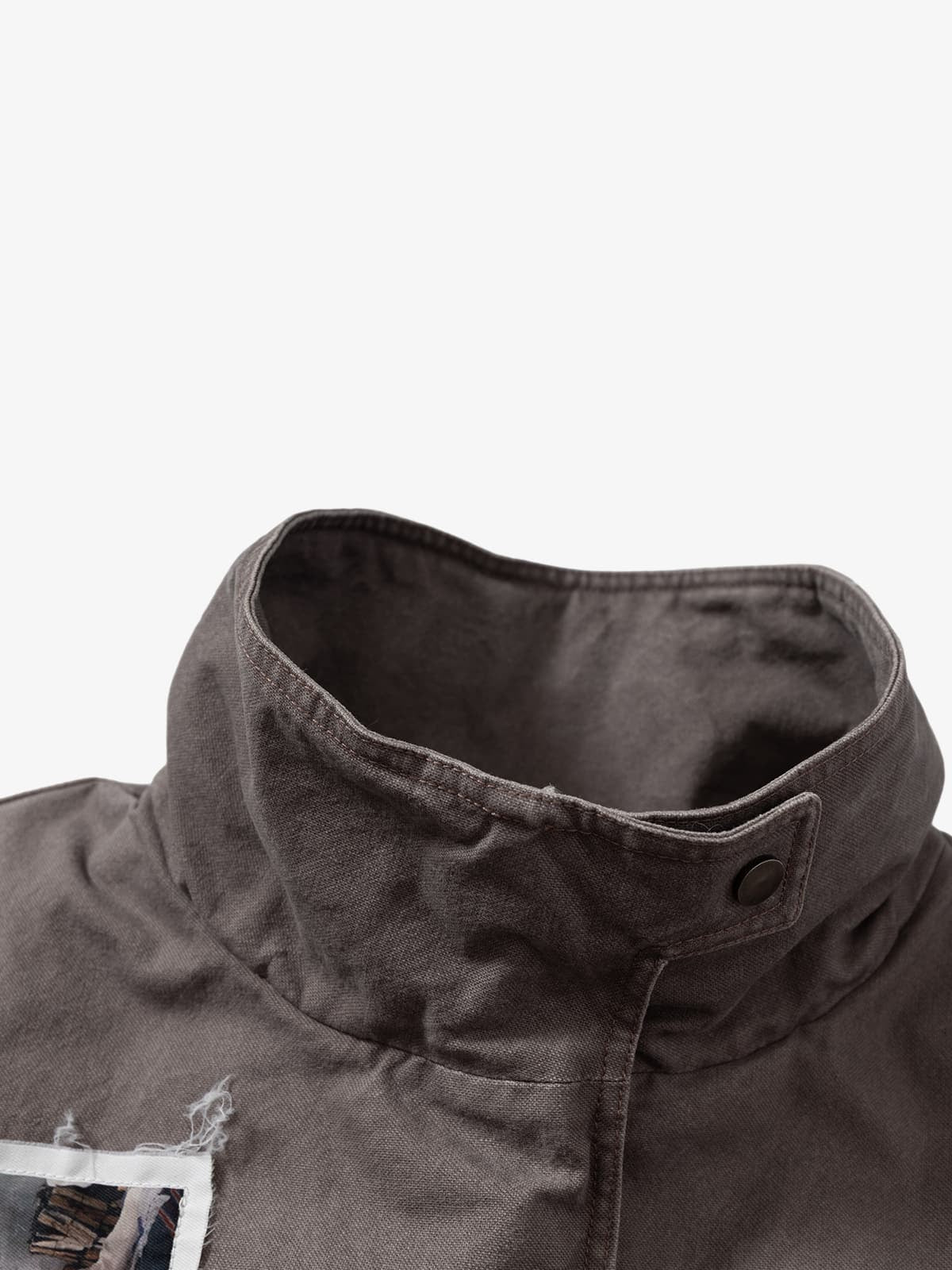 Close-up of the Graphic Graffiti High Neck Street Jacket, highlighting the textured charcoal fabric, stand-up collar, and snap-button tab, embodying bold streetwear style.