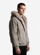 Young man models the Leopard Faux Fur Hooded Jacket, showcasing its plush fur-trimmed hood, leopard print, and elasticized details for a bold, warm streetwear look.