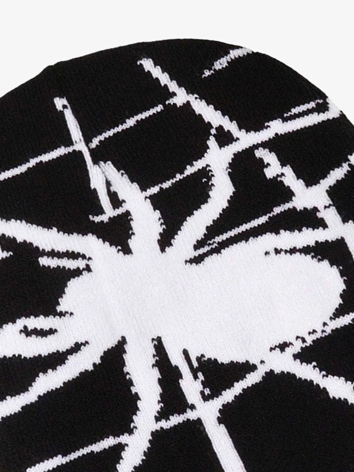 Spider Web Graphic Knit Hat featuring a bold white spider silhouette and web design on a black knit fabric, ideal for Y2K and grunge streetwear styles.