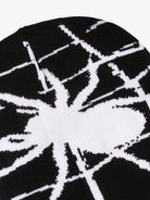 Spider Web Graphic Knit Hat featuring a bold white spider silhouette and web design on a black knit fabric, ideal for Y2K and grunge streetwear styles.