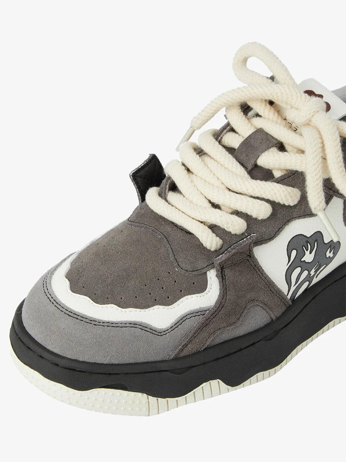 Vintage Chunky Graphic Skate Shoes with a chunky gray silhouette, cream laces, black midsole, and flame graphic, embodying retro skate style and streetwear flair.
