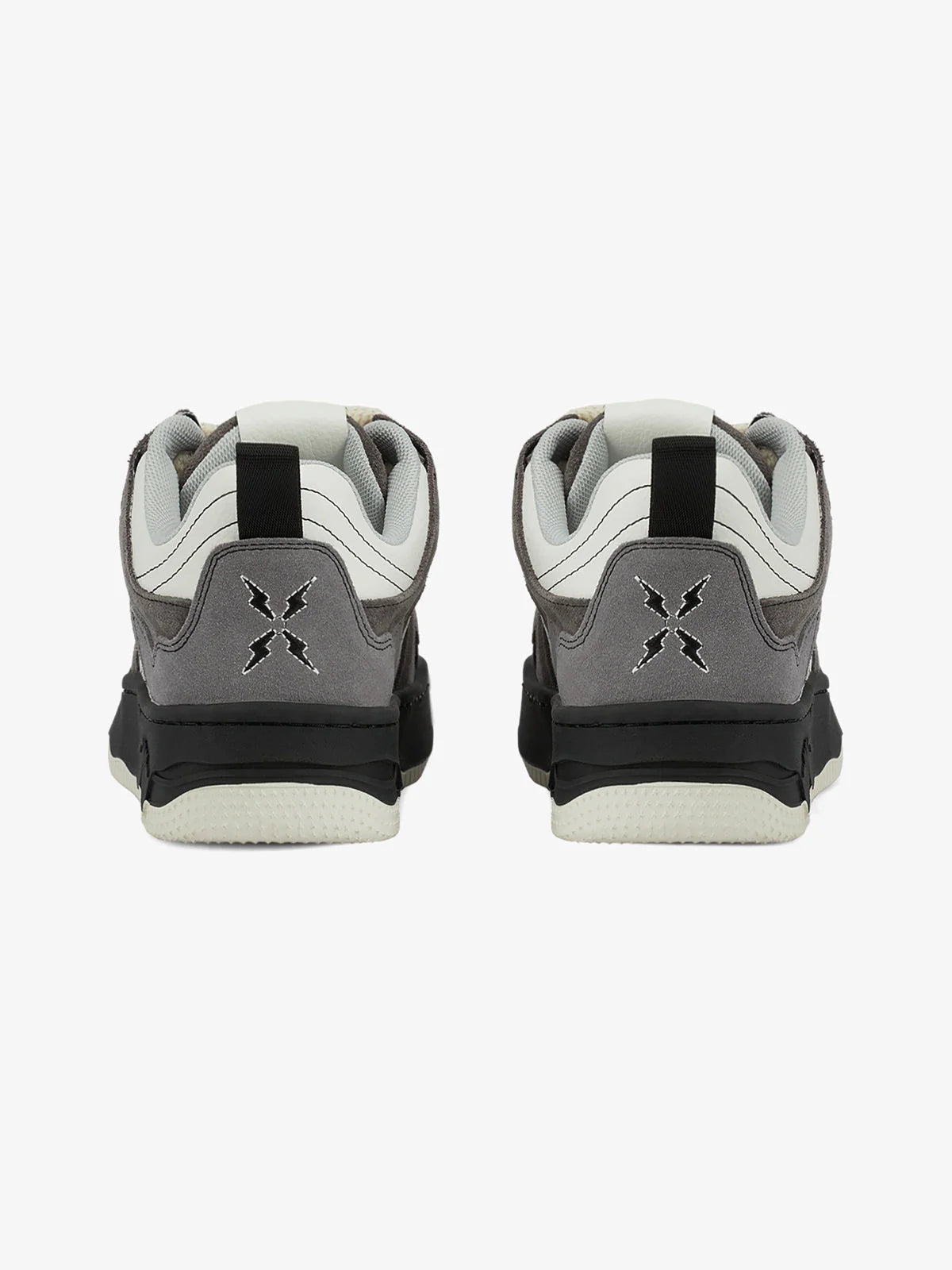 Back view of Vintage Chunky Graphic Skate Shoes, featuring grey suede heel panels, black midsoles, and white leather uppers, showcasing stitched logos and black heel pull-tabs.