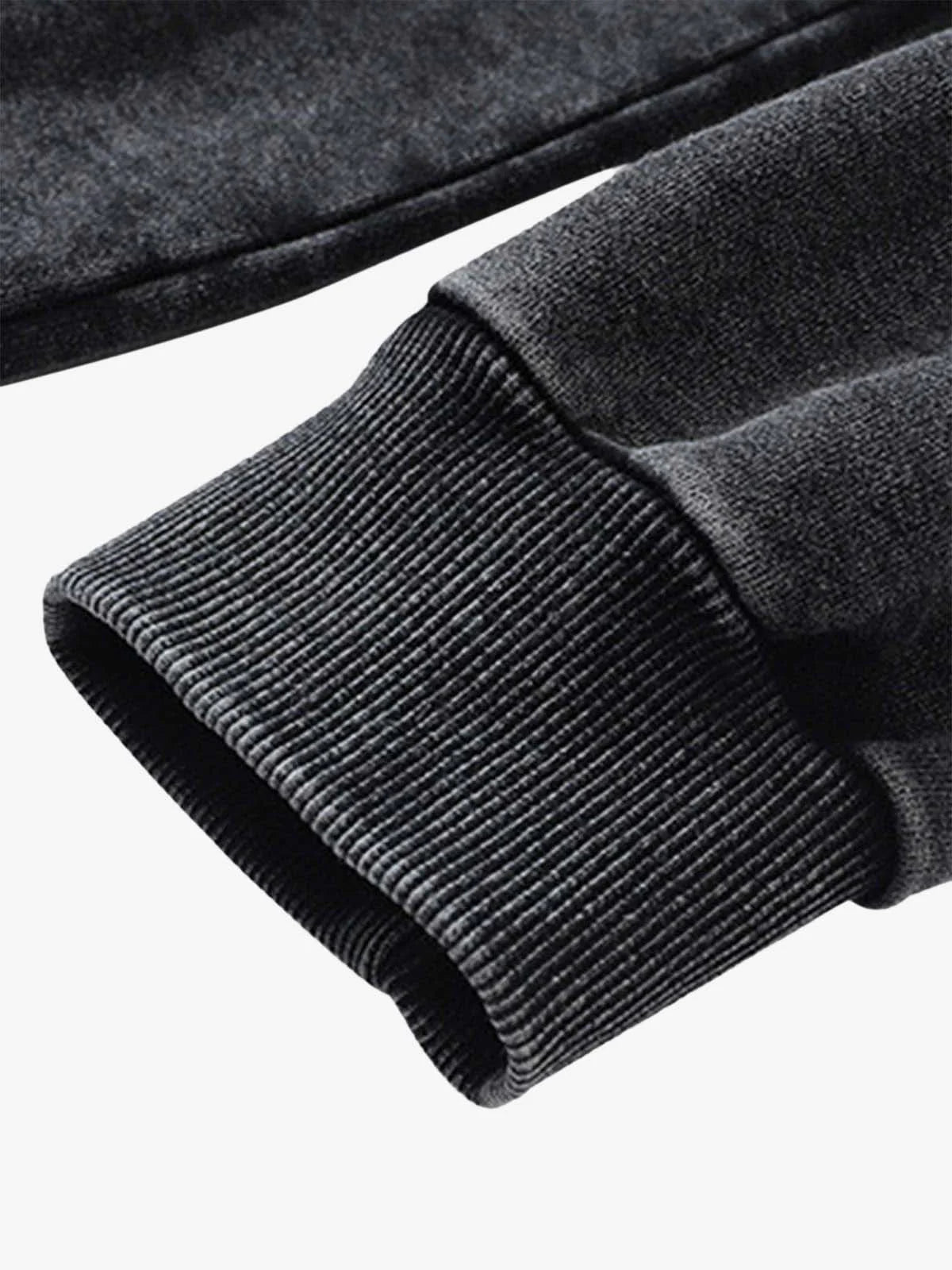Close-up of the rib-knit cuff on the Vintage Doberman Graphic Streetwear Hoodie's sleeve, showcasing its textured dark gray fabric and relaxed streetwear style.