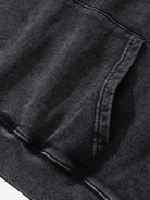 Close-up of the Vintage Doberman Graphic Streetwear Hoodie showing the kangaroo pocket and ribbed hem, highlighting its bold, washed streetwear aesthetic and relaxed fit.