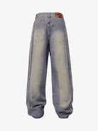 Washed Distressed Raw-Edge Baggy Jeans with oversized, wide-leg fit, back patch pockets, and frayed side seams, embodying Y2K and grunge-inspired streetwear style.