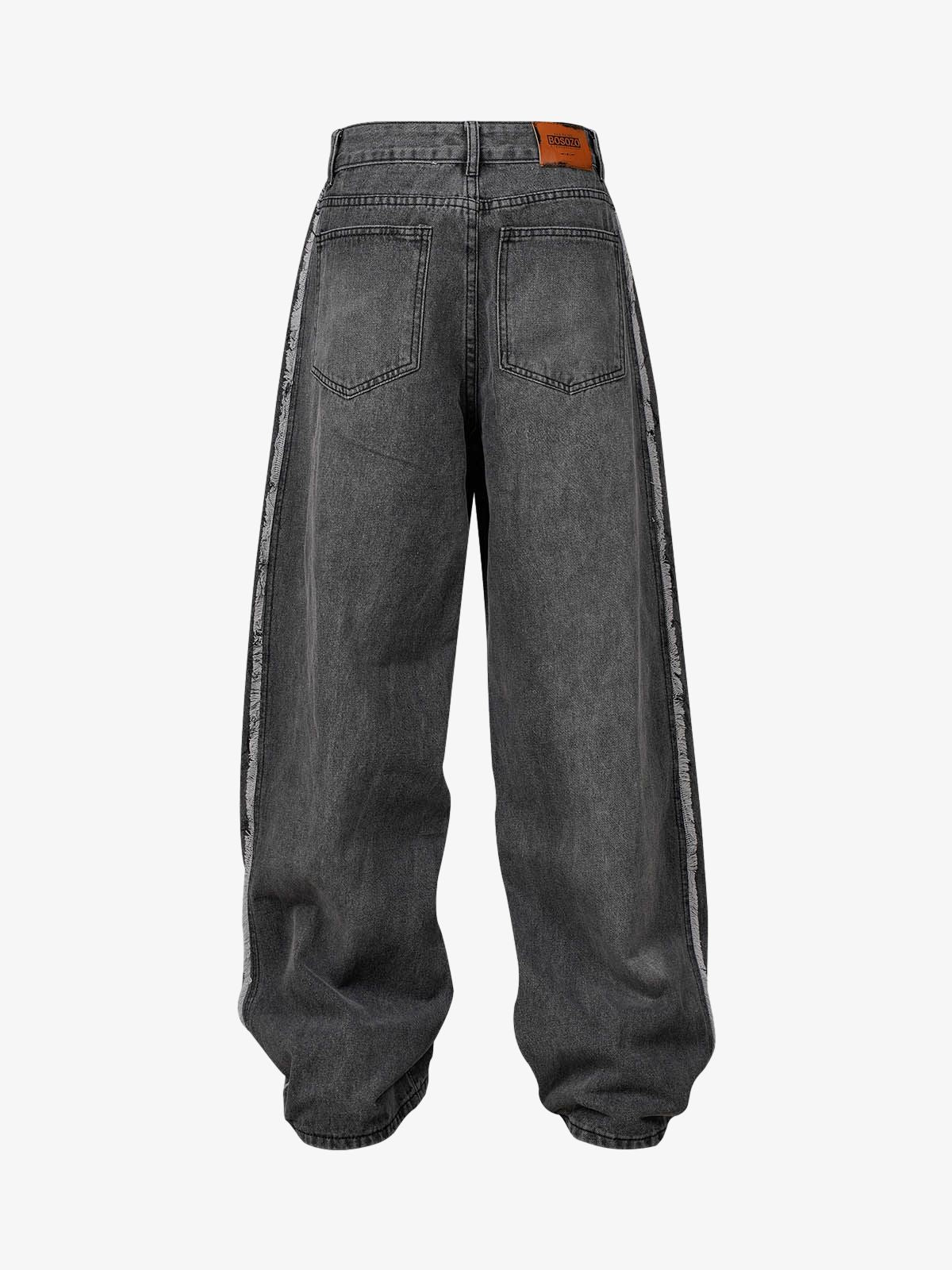 Back view of Washed Distressed Raw-Edge Baggy Jeans with frayed stripes, patch pockets, leather-look waistband label, and extra length gathering at hems.