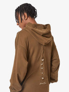 Back view of Washed Skeleton Graphic Streetwear Hoodie with bird-skull cutouts and Hidden Smoke embroidery, showcasing its oversized fit and vintage streetwear style.