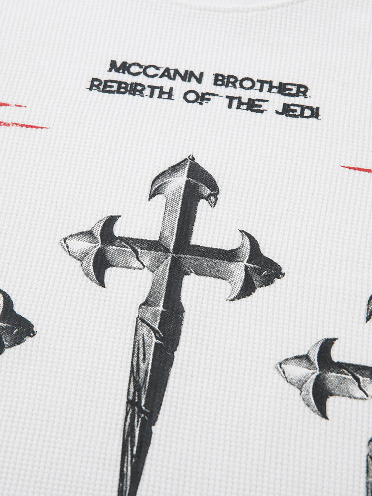 White Waffle Cross Graphic Long Sleeve T-Shirt featuring McCann Brother – Rebirth of the Jedi text and bold cross dagger design on textured waffle-knit fabric.